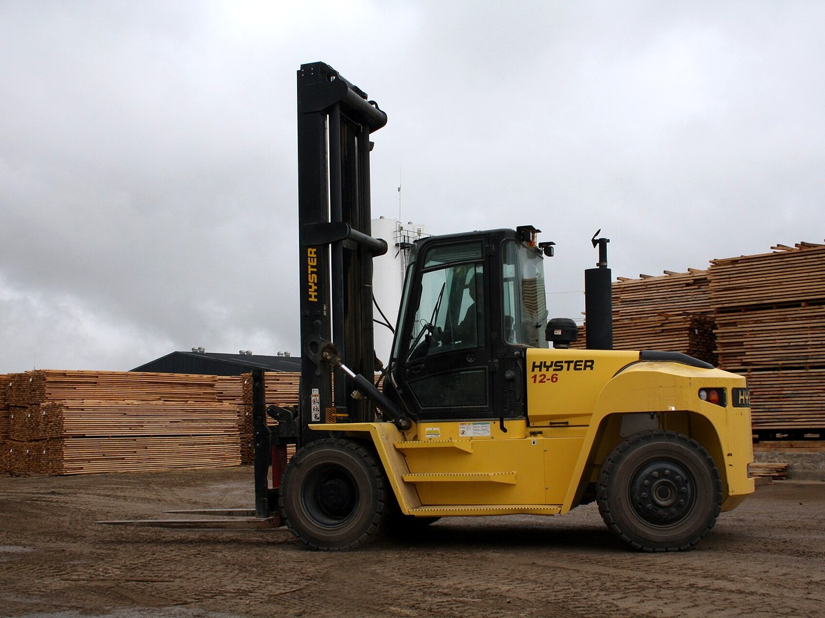 Large diesel Hyster forklift with pneumatic tires on an outdoor industrial site